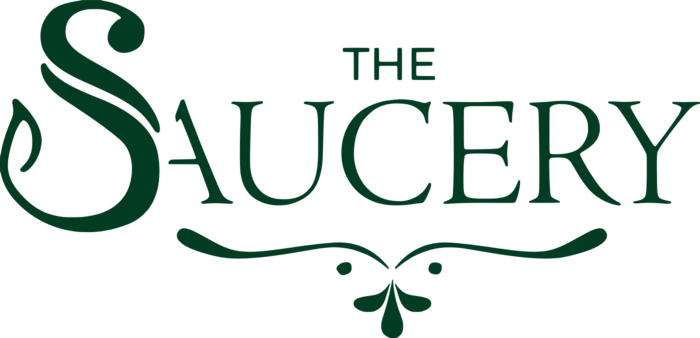 The Saucery wordmark: an engraved capital S with a long swash, set against the words &ldquo;The Saucery&rdquo;.